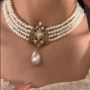 Elegant French multi-strand pearl choker with rhinestone teardrop pendant