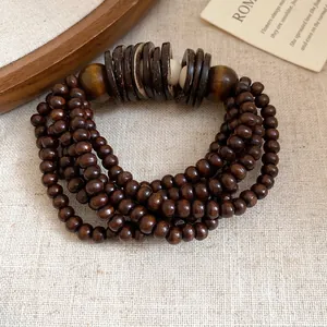 Bracciale elastico multistrato vintage in perline di legno marrone scuro e guscio di cocco