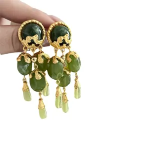 Retro olive green tassel drop earrings with vintage gold-tone finish and silver needles