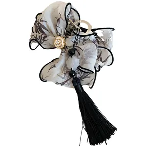 Elegante pinza para el cabello estilo chino con estampado de bambú y borla negra