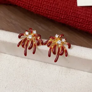 18K gold plated firework stud earrings with red enamel and sparkling zircons.