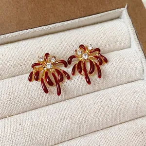 Exquisite 18k gold plated firework stud earrings with red enamel and sparkling zircons