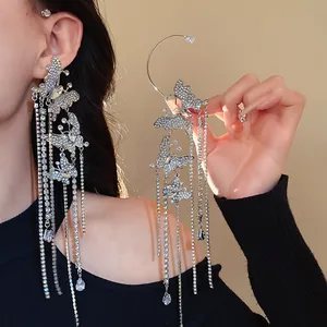 Close-up of sparkling butterfly tassel ear cuff with long crystal fringes