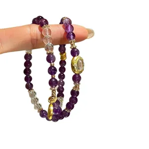 Set di bracciali con perline di ametista e cristallo con ciondolo sole oro