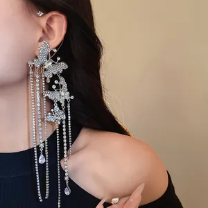 Detailed view of silver butterfly tassel ear cuff with sparkling zircon stones and fringe