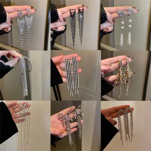 Detailed collage of nine silver needle rhinestone tassel earrings for bridal evening wear