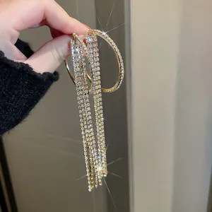 Sparkling oversized rhinestone tassel hoop earrings for bridal or evening gala.