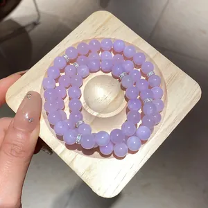 Élégant bracelet en perles de cristal lavande avec intercalaires en strass argentés