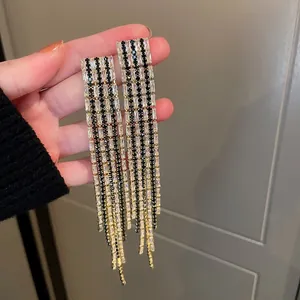 Stunning long tassel earrings with black and clear crystals for evening parties.
