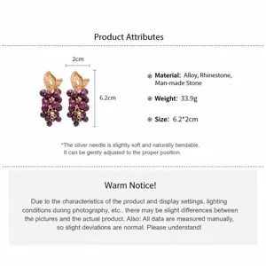 Detailed macro view of purple grape cluster earrings with golden rhinestone leaves