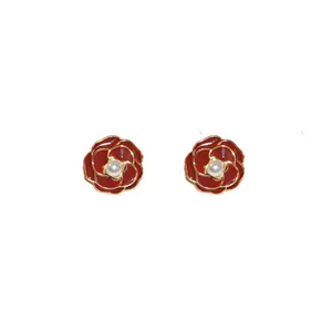 Elegant red enamel rose stud earrings featuring a pearl center and gold plating.