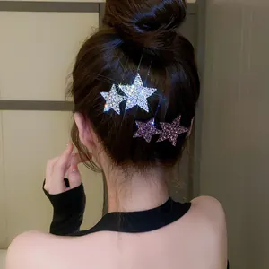 Detail view of sparkling rhinestone star hair clips for elegant Y2K hair styling