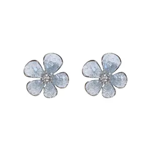 Elegant flower-shaped crystal stud earrings with light blue petals