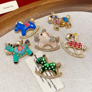 Fashionable colorful enamel rocking horse brooches set with sparkling rhinestone accents