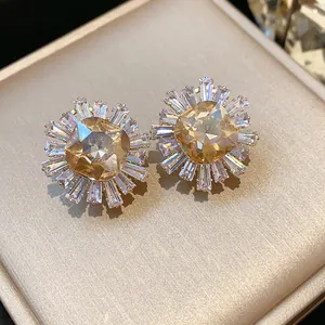 Macro view showing the intricate details of vintage champagne zircon floral stud earrings