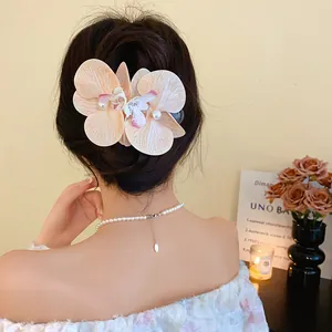 Elegant orchid fabric flower hair clip with pearls for beach vacation hairstyles