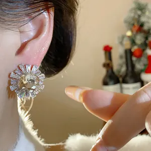 Detailed close-up of a vintage zircon stud earring worn on the ear for a luxury look