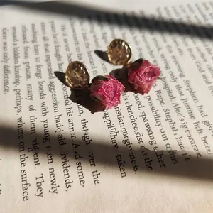 Handmade preserved pink rose drop earrings with golden disc accents and silver needles