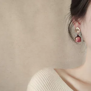 Elegant preserved pink rose bud drop earrings with gold hammered studs and silver needles
