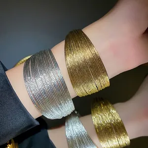 Elegant multi-layer gold and silver plated open bangles with shimmering metallic texture