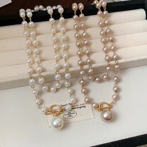 Elegante collana di perle vintage francese con chiusura a T e grande ciondolo di perla
