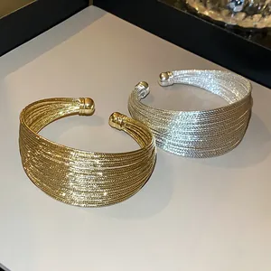 Elegant multi-strand layered open bangles in gold and silver finish with mesh texture