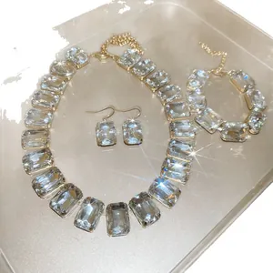 Elegant vintage rhinestone jewelry set including necklace and earrings with clear crystals