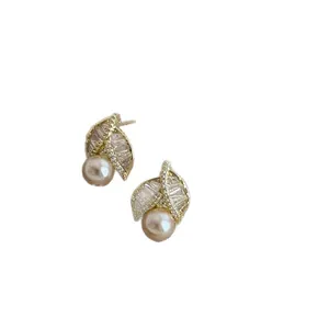 Elegant French style leaf-shaped pearl stud earrings with gold-plated zircon accents for women