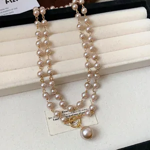 Elegante collana di perle vintage francese a due fili con chiusura a levetta dorata