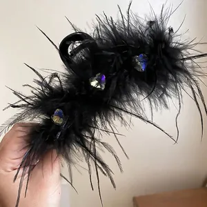 Elegant black feather hair claw clip decorated with iridescent heart-shaped crystals for women