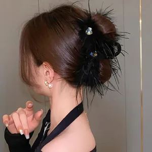 Elegant black feather hair claw clip with heart-shaped crystal rhinestones for women