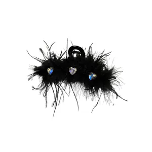 Elegant black feather hair claw clip decorated with sparkling heart-shaped rhinestones
