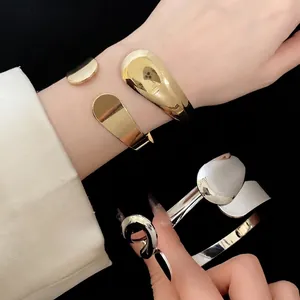 Retro fashion metallic water drop open cuff bracelet in polished gold and silver finishes