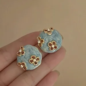 Elegant blue flower stud earrings with drip oil texture and sparkling crystal rhinestones.