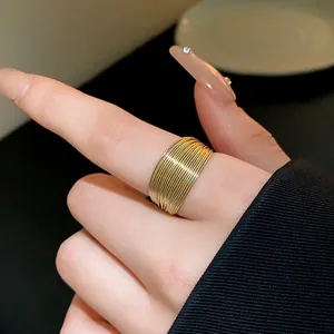 Detailed view of a minimalist gold multi-layer wire wrapped ring for modern styling
