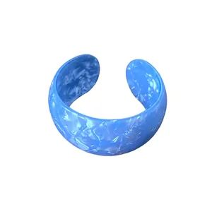 Fashionable chunky blue iridescent acrylic open cuff bracelet with elegant marbled texture