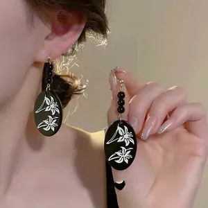 Vintage New Chinese style black oval earrings with white lily floral print and beads