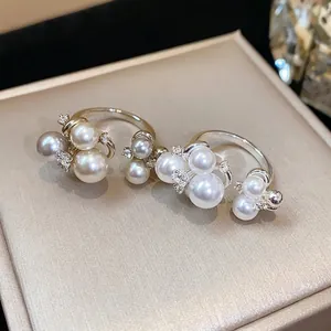 French style zircon flower pearl ring with elegant gold and silver finish for women.