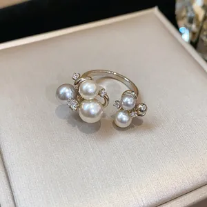 Elegant French style open ring featuring multiple pearls and sparkling zircon accents