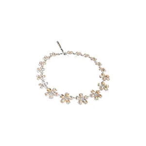 Elegant floral design necklace featuring sparkling rhinestones and champagne crystals