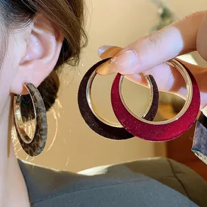 Elegant flocked hoop earrings set with leopard print and velvet textures for winter fashion