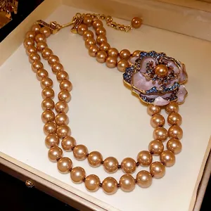 Vintage French style double-strand pearl necklace with a rhinestone flower pendant