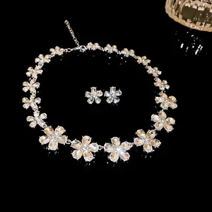 Detail shot of elegant sparkling crystal flower necklace and matching earring jewelry set