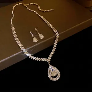 Elegant gold-tone rhinestone waterdrop necklace and earrings jewelry set for women