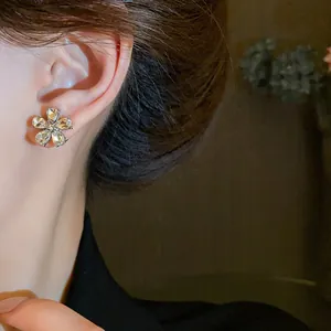 Elegant rhinestone flower stud earrings with silver needles for a stylish niche look