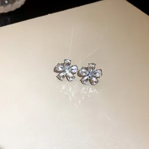 Detailed close-up view of elegant flower stud earrings with sparkling crystal petals and silver needle