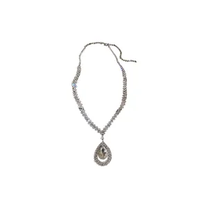 Elegant silver-toned necklace featuring a sparkling rhinestone-encrusted teardrop pendant