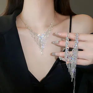 Sparkling rhinestone tassel necklace and bracelet jewelry set on model.