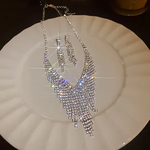 Dazzling rhinestone water drop tassel necklace and earring set with silver finish