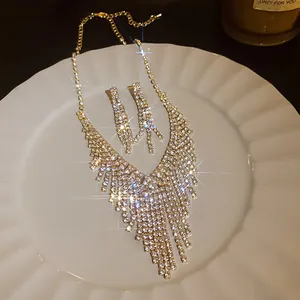 Detail view of sparkling rhinestone geometric necklace and matching earrings set